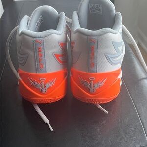 Puma Melo Low-Top Sneakers in Light Gray and Bright Orange